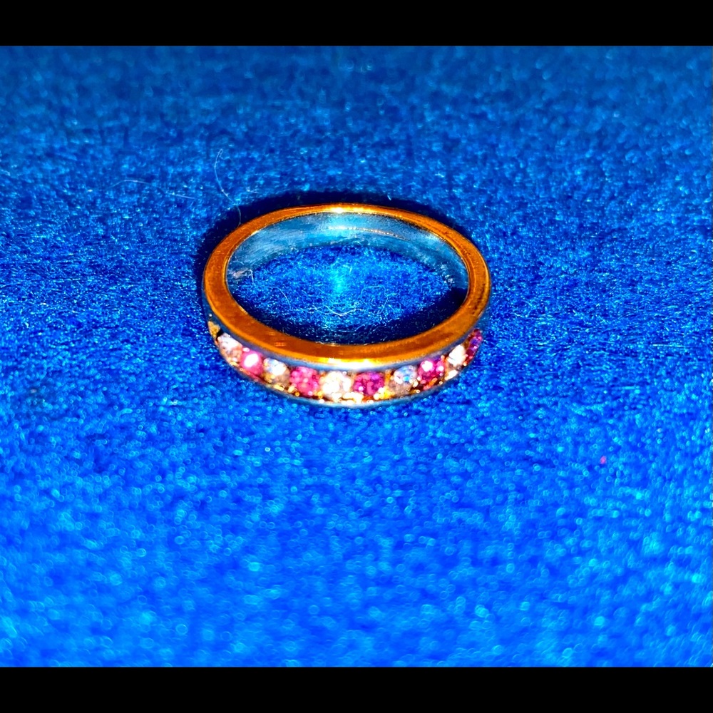 Gold ring with unknown/untested pink and white stones.